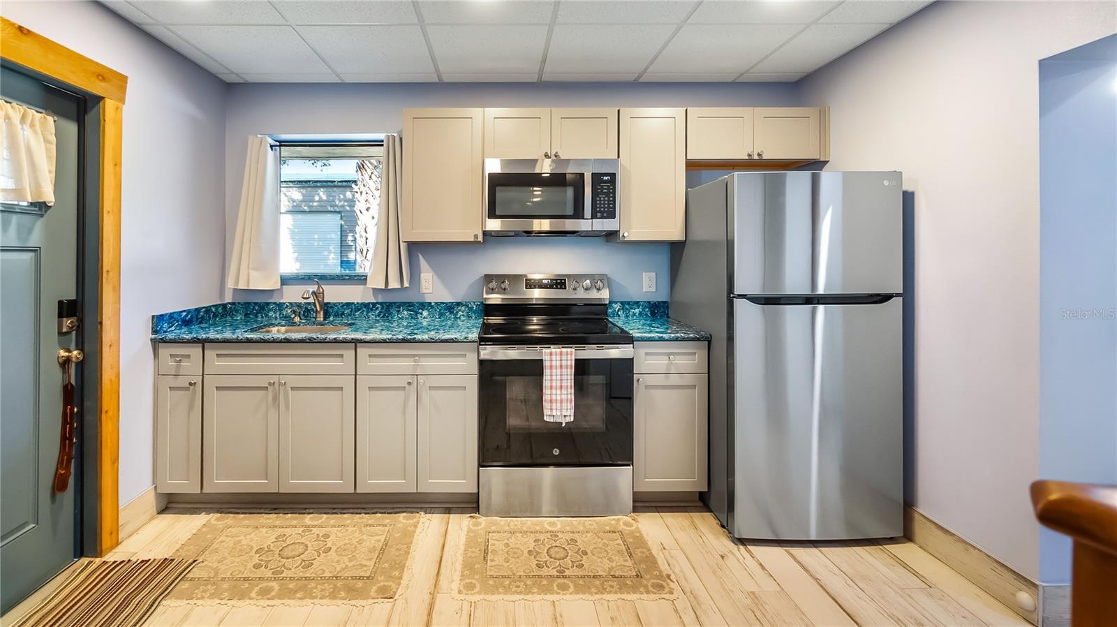 Detached garage and apartment. 2 car parking plus storage. Driveway off Lakeshore drive, little fenced in back yard. Full kitchen, laundry closet. remodeled. Pre wired for generator plug access so it can be run on a generator.