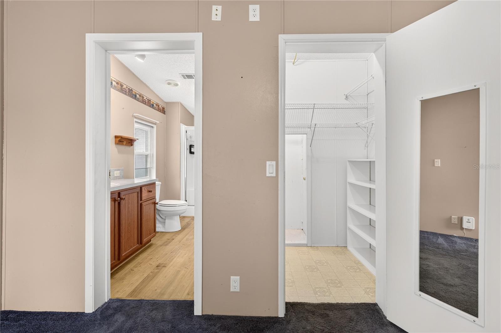 Primary bedroom walk-in closet & ensuite