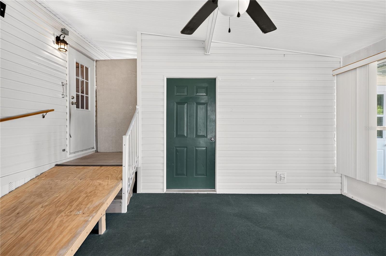 Side door entry to Florida room and workshop/bonus room