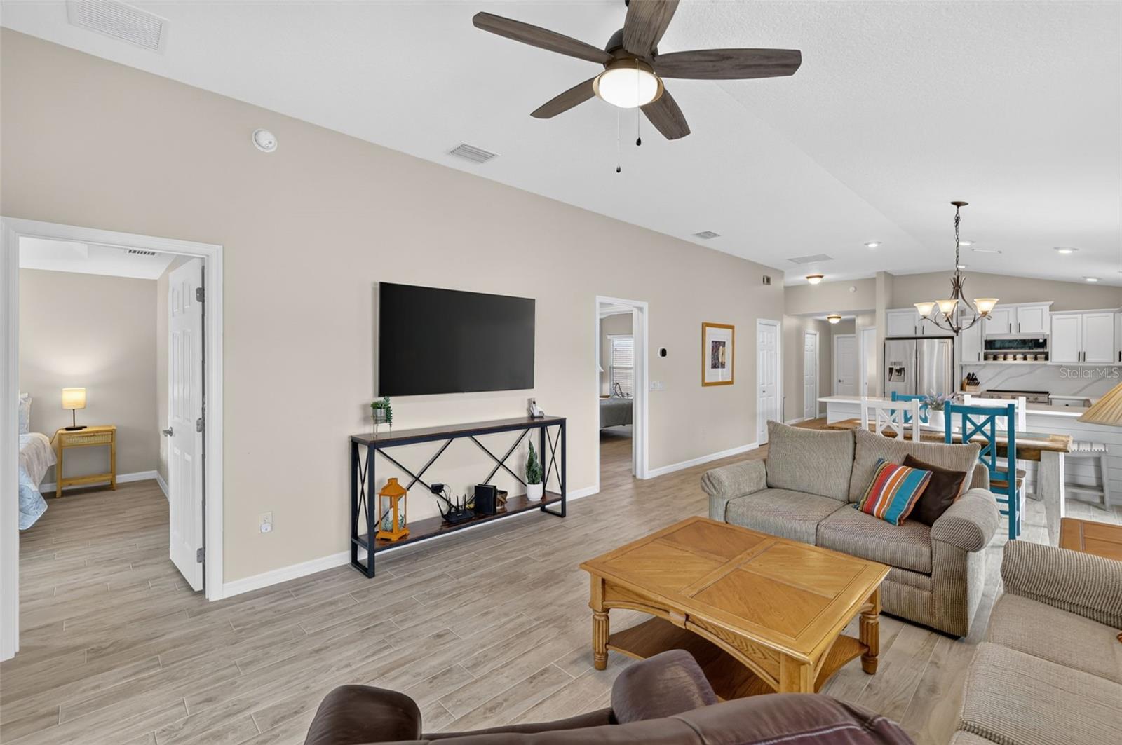 Living Room - Door to the left goes to the Primary Suite and door to the right goes to the 2nd Bedroom and Bath