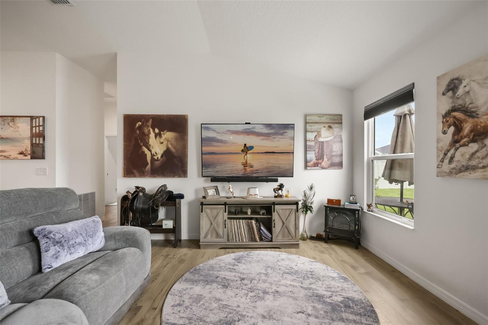 TV stand and wall art does not convey