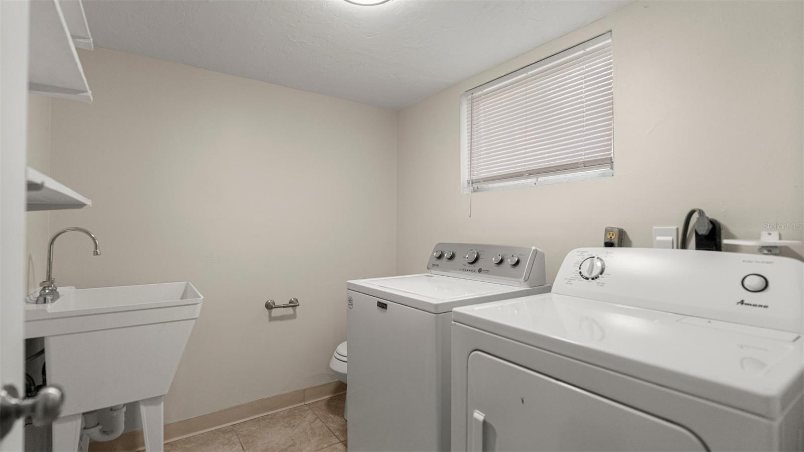 Laundry and half bath off of bottom floor bonus room