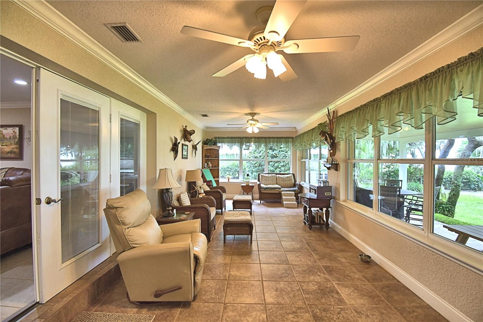 FL Room, wall of windows, view of lake & AC
