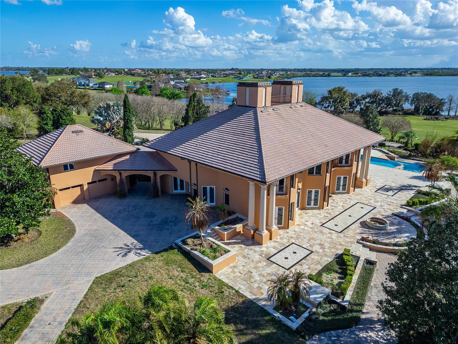 Completing the property are two separate two-car garages, including a beautifully finished main garage with tiled flooring and cherry wood walls and ceilings.