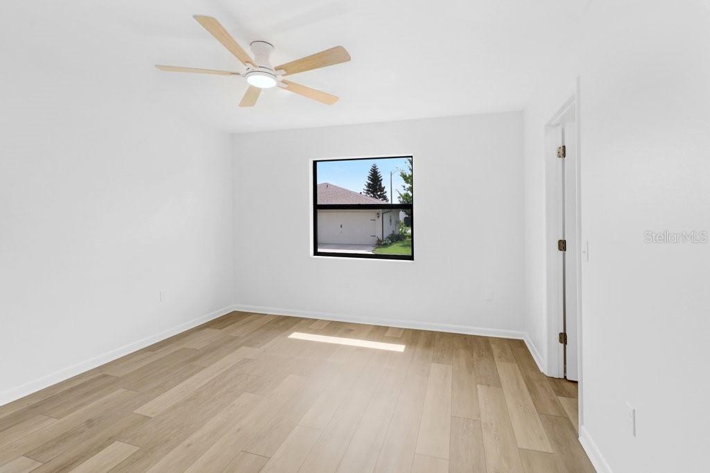 Second Bedroom with direct access to the hall bath. 6x9 walk in closet to the rear of photo.