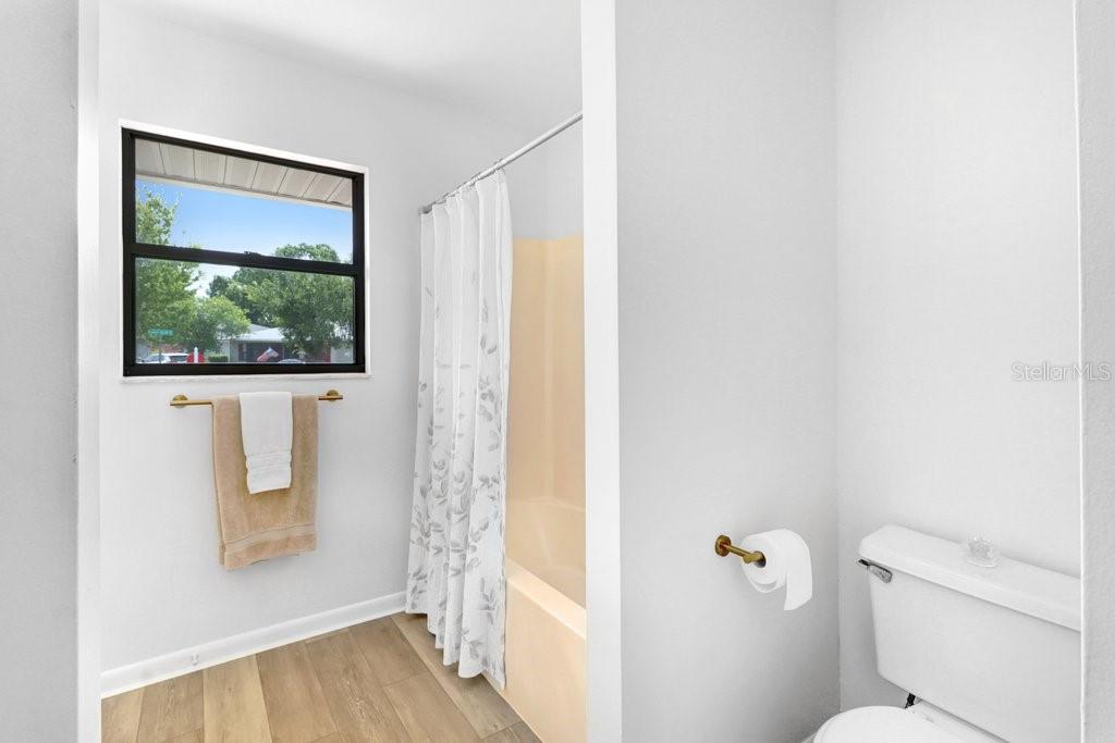 Jack and Jill Bath accessed from the Hall and second bedroom. Tub/shower combo, linen closet, new hardware, mirror and light.