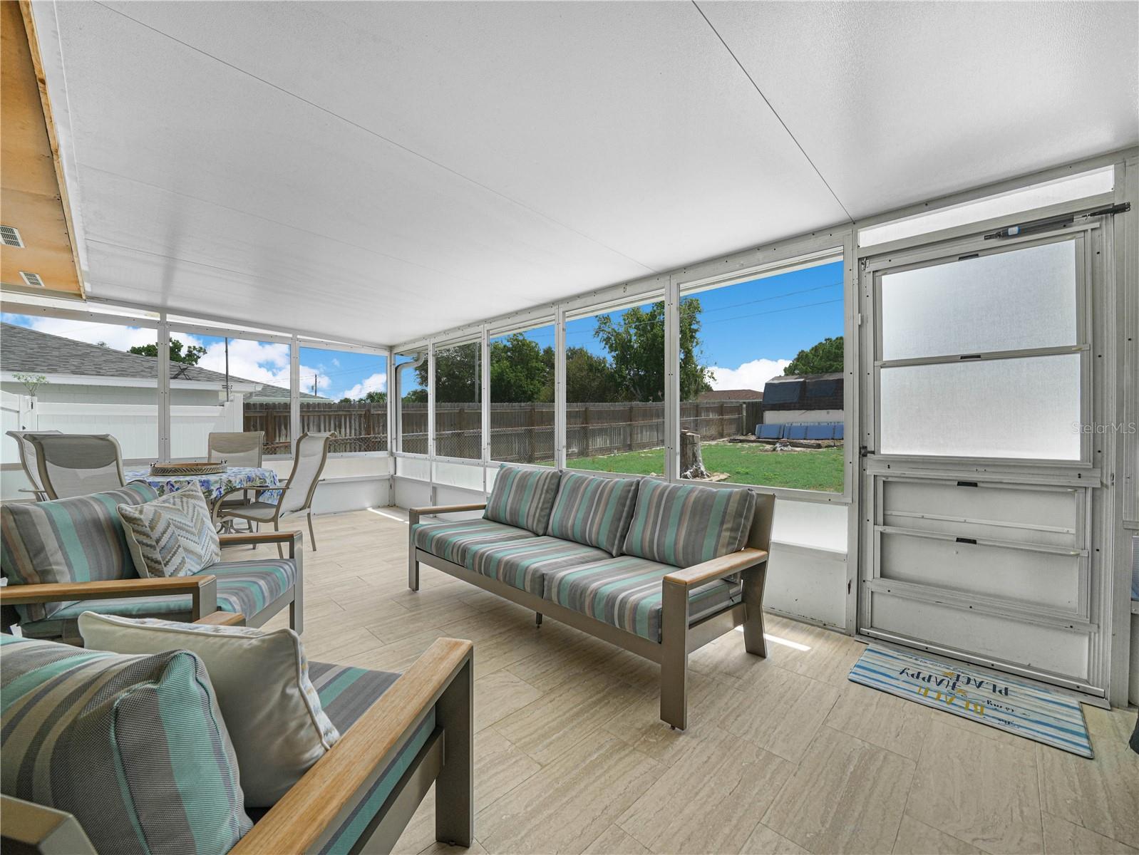 Large tiled screened-in patio
