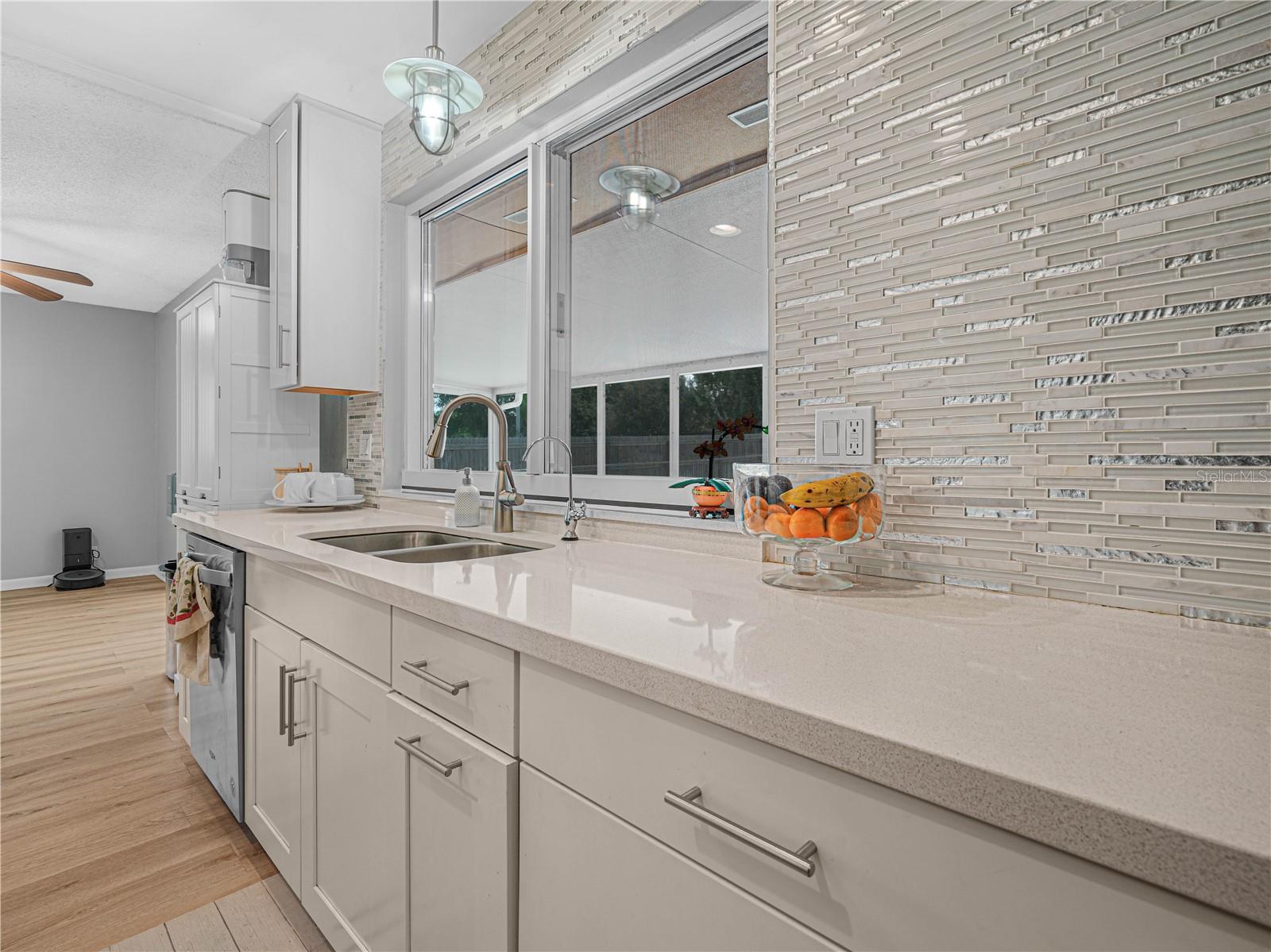 updated kitchen with pass-through window for easy access to patio guests