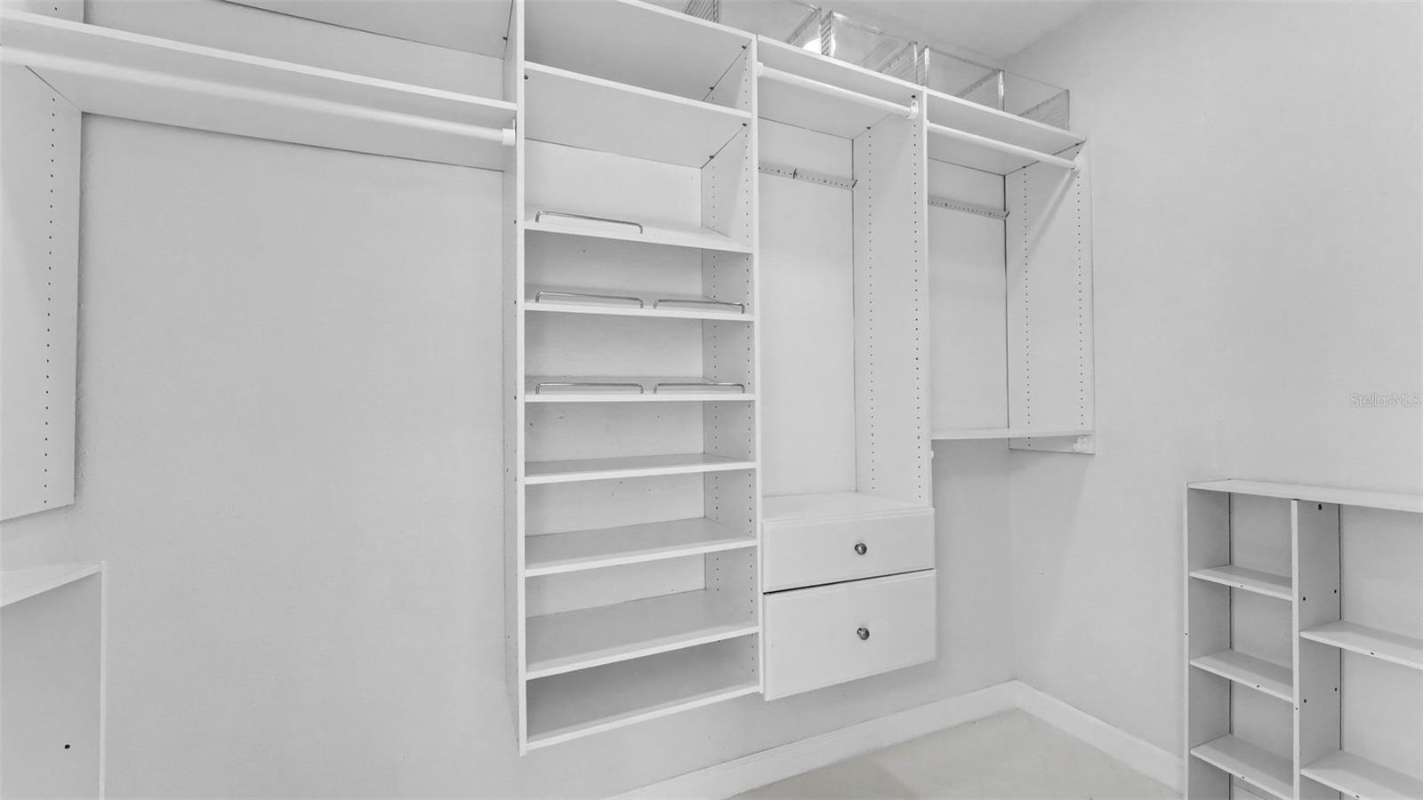 Primary Suite Walk in closet with built ins