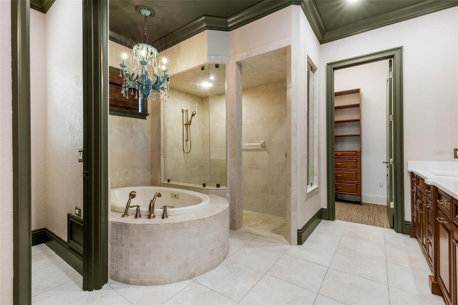 The deep jetted tub and fully tiled walk-in shower.