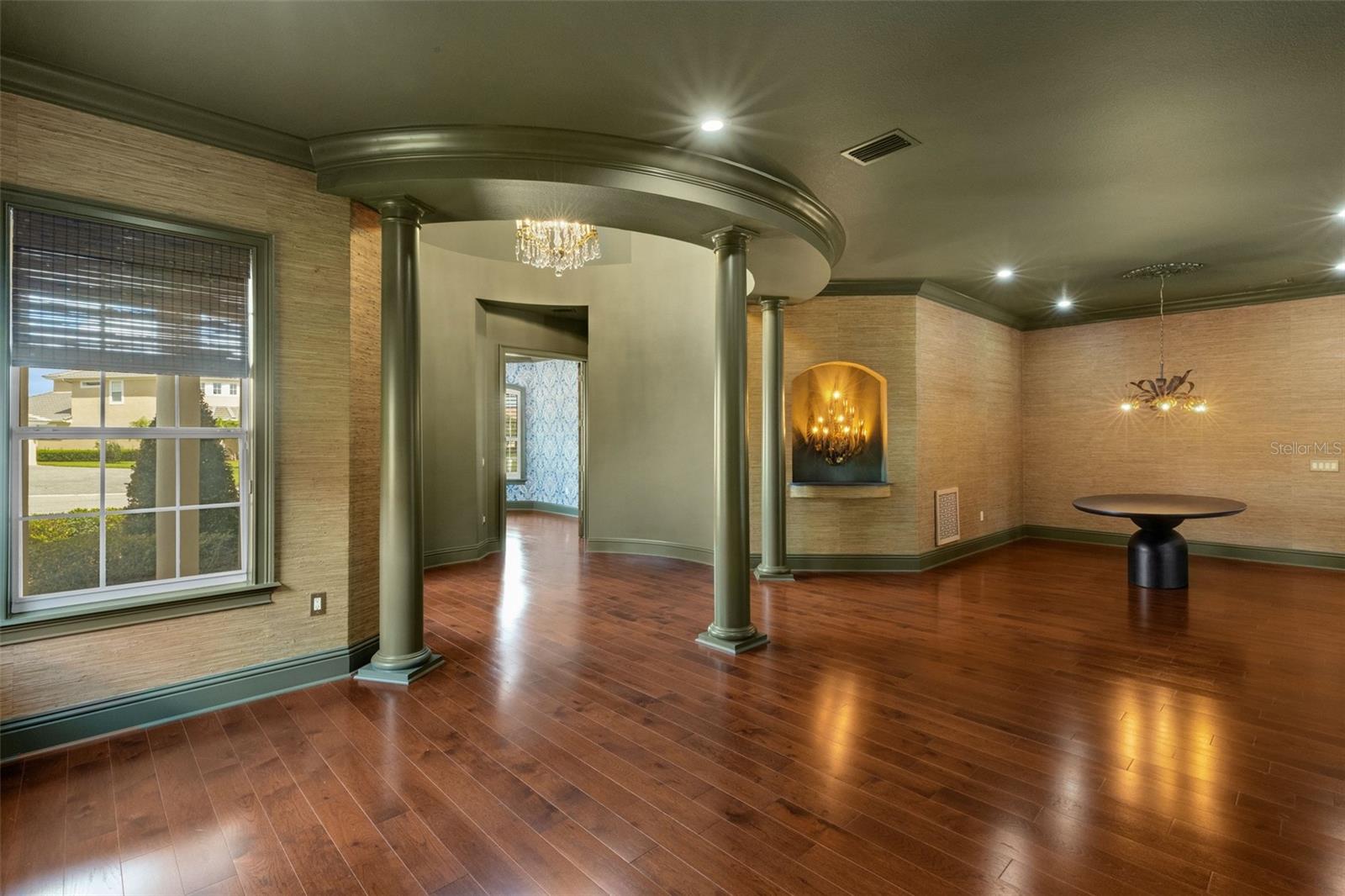 With gleaming wood flooring throughout, 12' ceilings and dramatic "one of a kind" architectural elements.