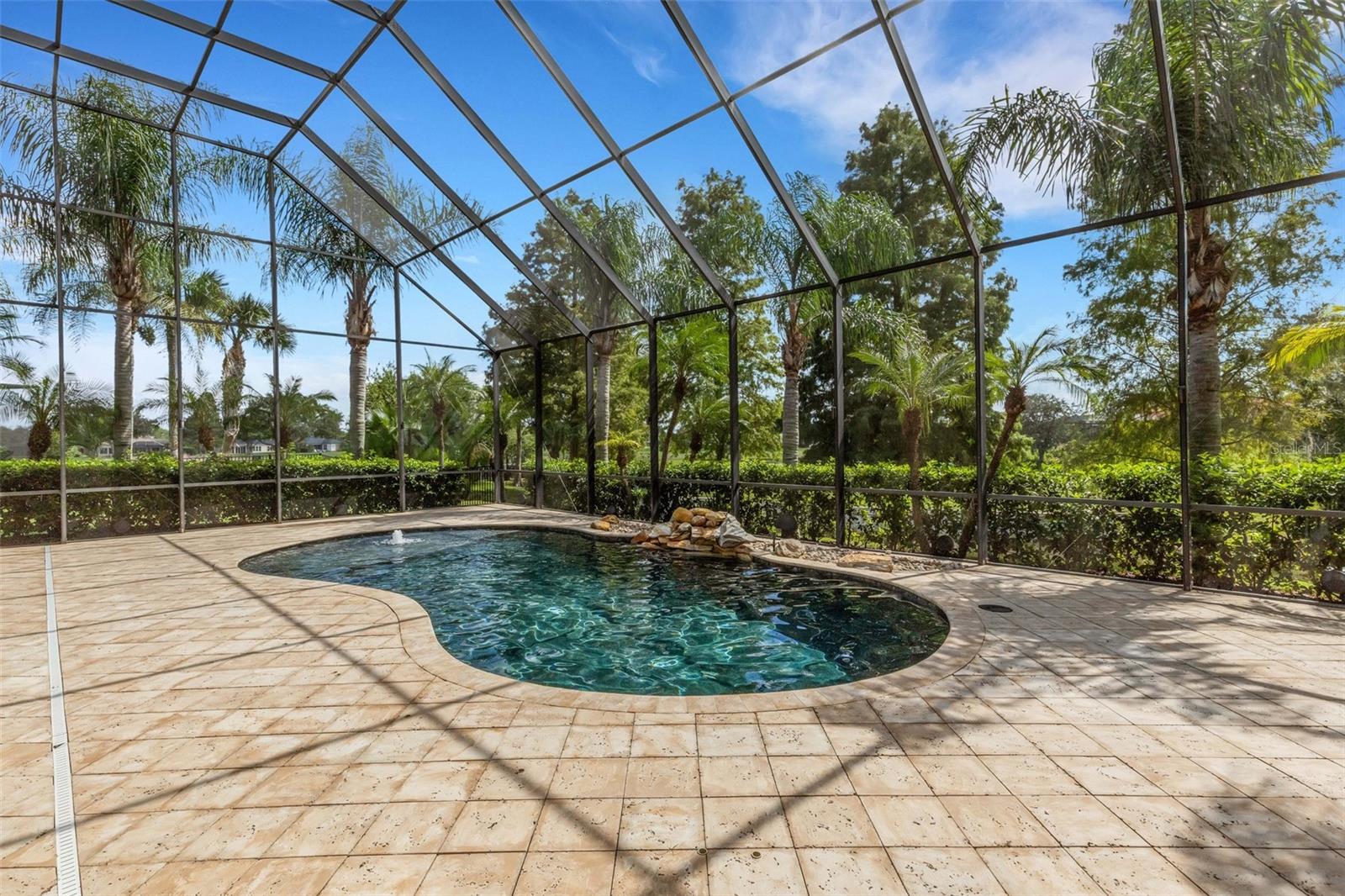 Completely screen enclosed by a 2-story structure.