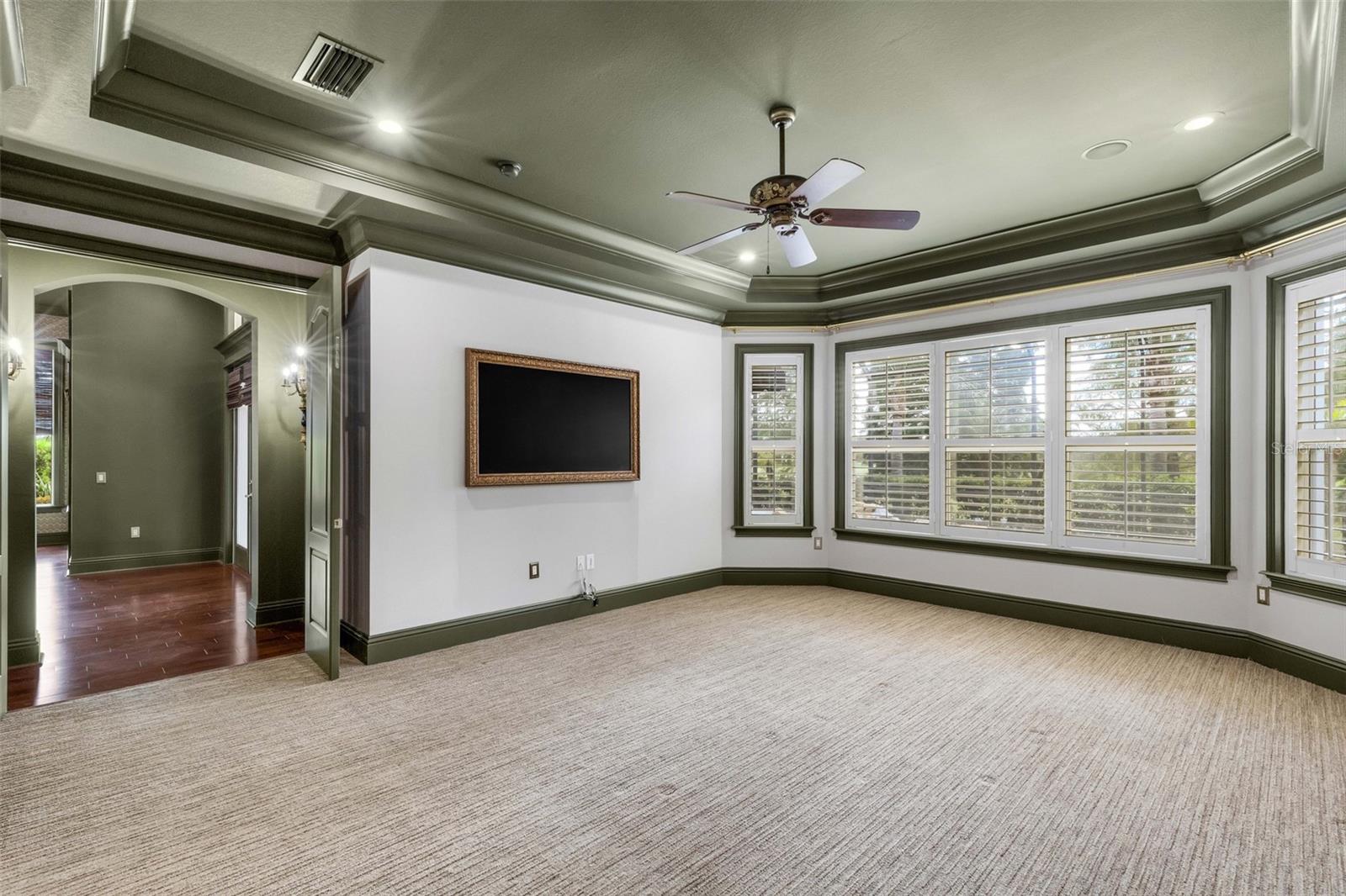 The sellers have opted to leave the framed wall mounted TV that provides a touch of elegance that the standard big screen can't come close to duplicating.