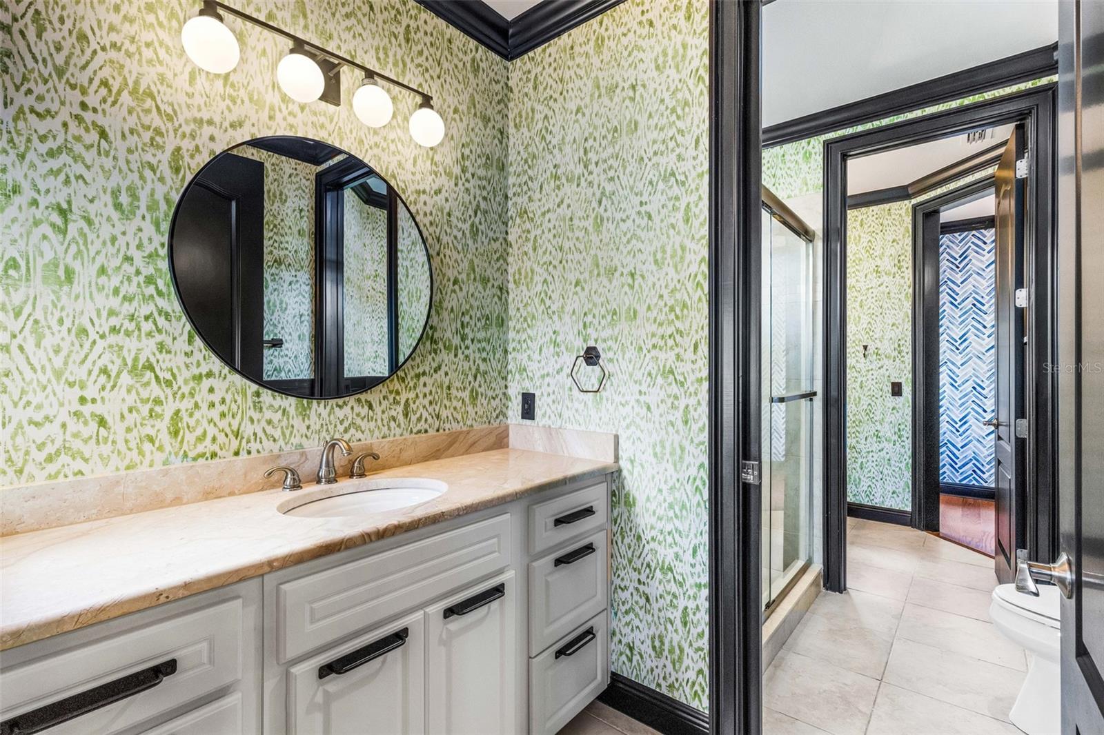 a private bathroom vanity area to the shared "J & J" bathroom.