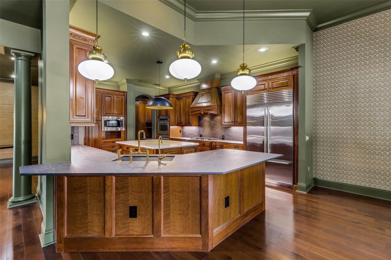 The custom Dekton countertops are made by Cosentino that blends minerals used in glass, porcelain and quartz forming an ultra durable material that is resistant to heat water, stains, UV light, and scratches and will withstand whatever you throw its way!!