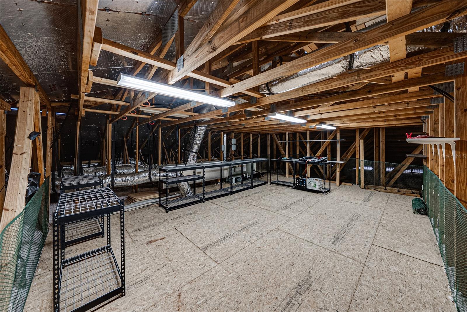 Extra attic access from bonus room with ample storage and attic fan
