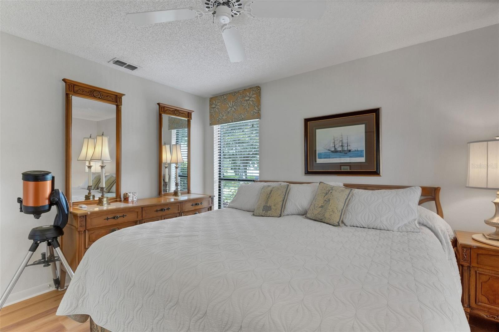 Two tall windows bring in plenty of natural light.