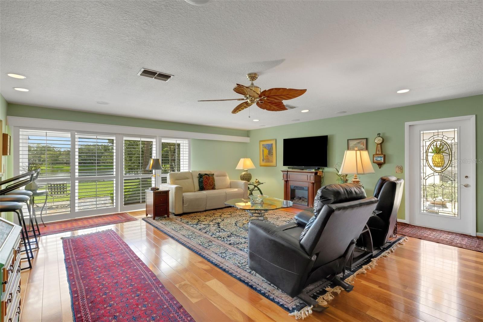Next let's explore the 20' x 22' family room with sliders leading to the outside open flagstone patio . . .