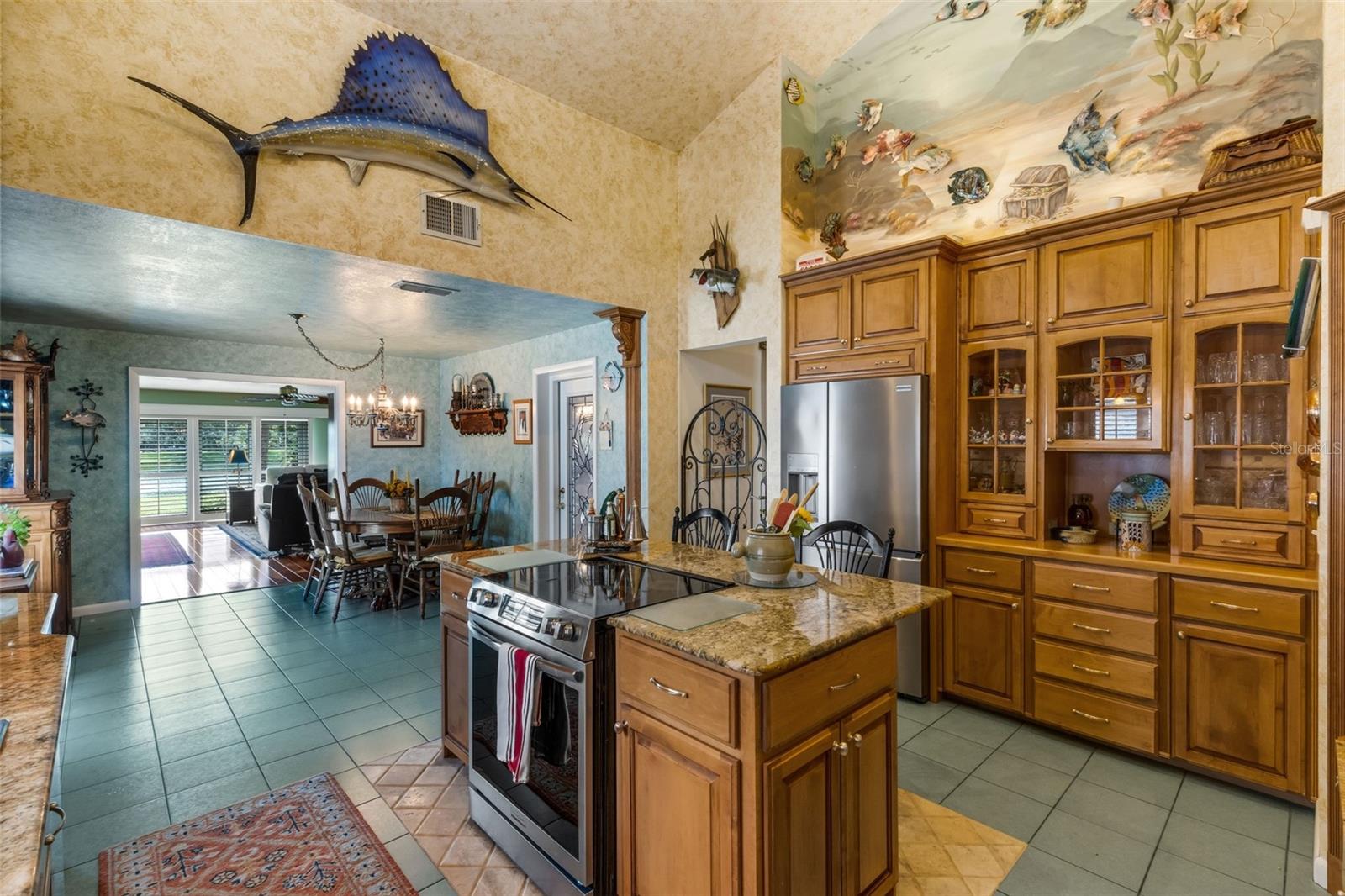 Stepping into the kitchen you will be amazed at the amount of storage afforded by the newer solid wood cabinets.
