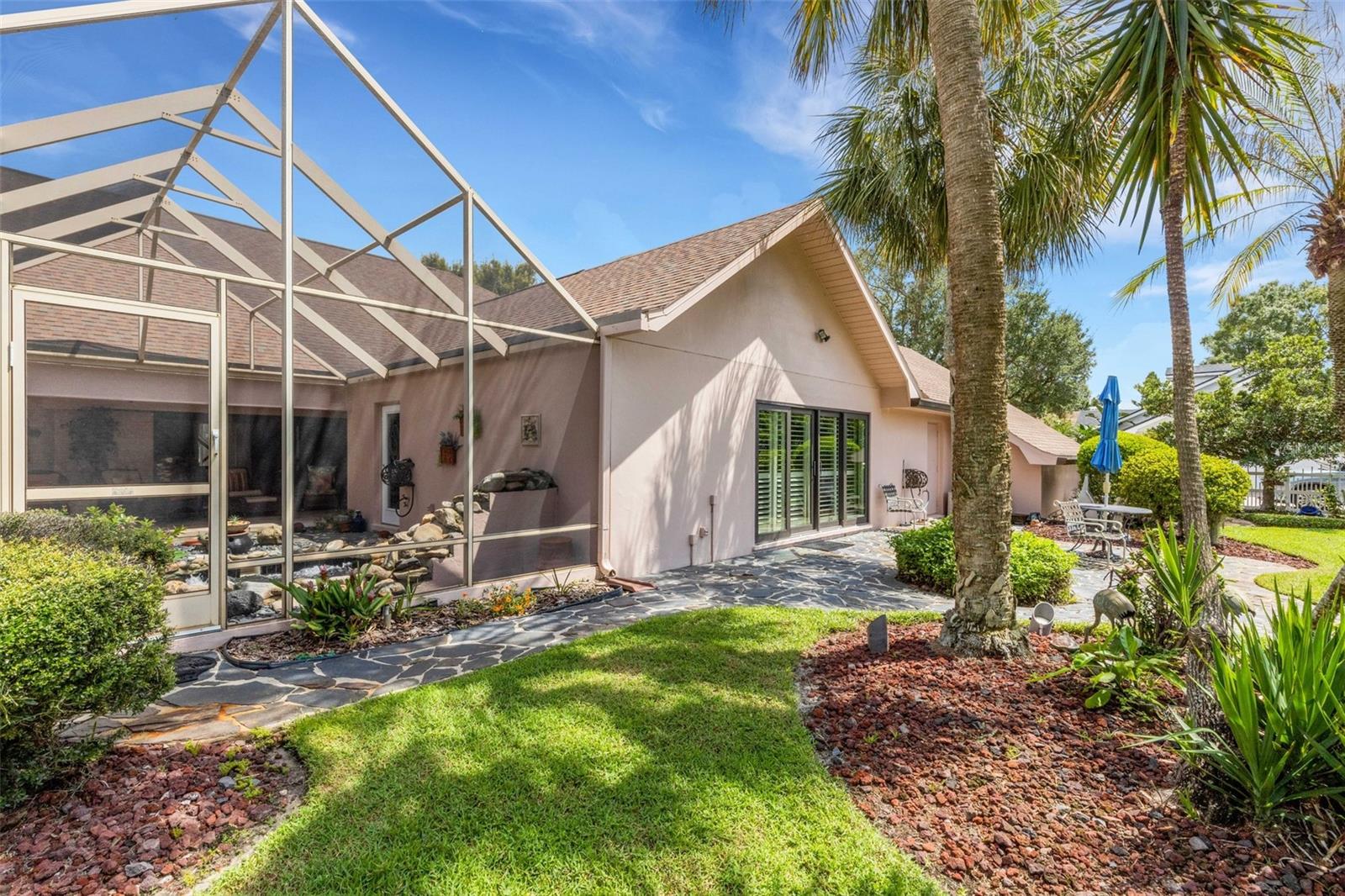 This space is also accessible from the family room through large sliding glass doors.