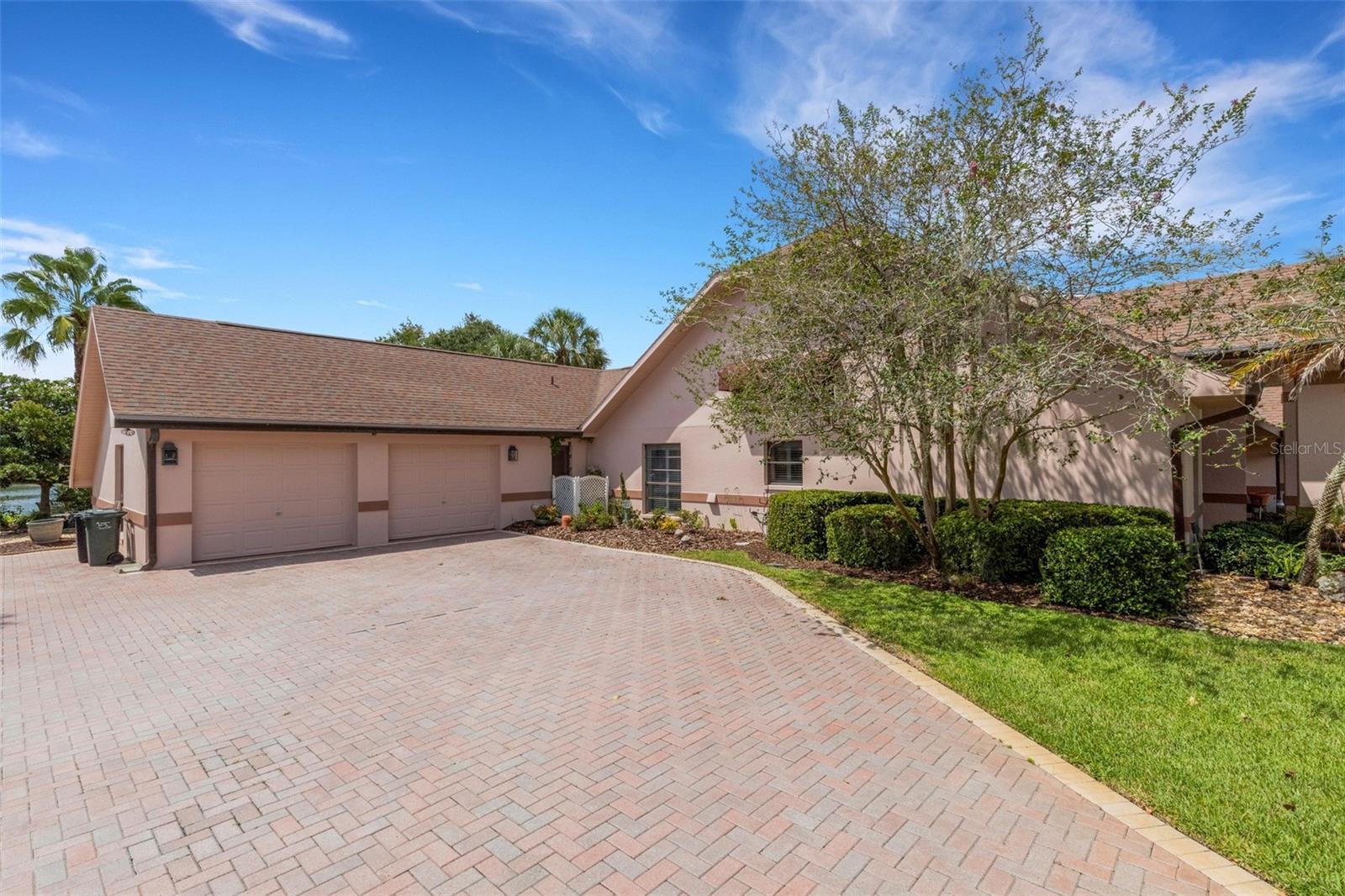 Situated at the end of a long cul-de-sac street the home also features an oversized 2-car garage and wide sweeping brick paver driveway affording plenty of guest parking when necessary.