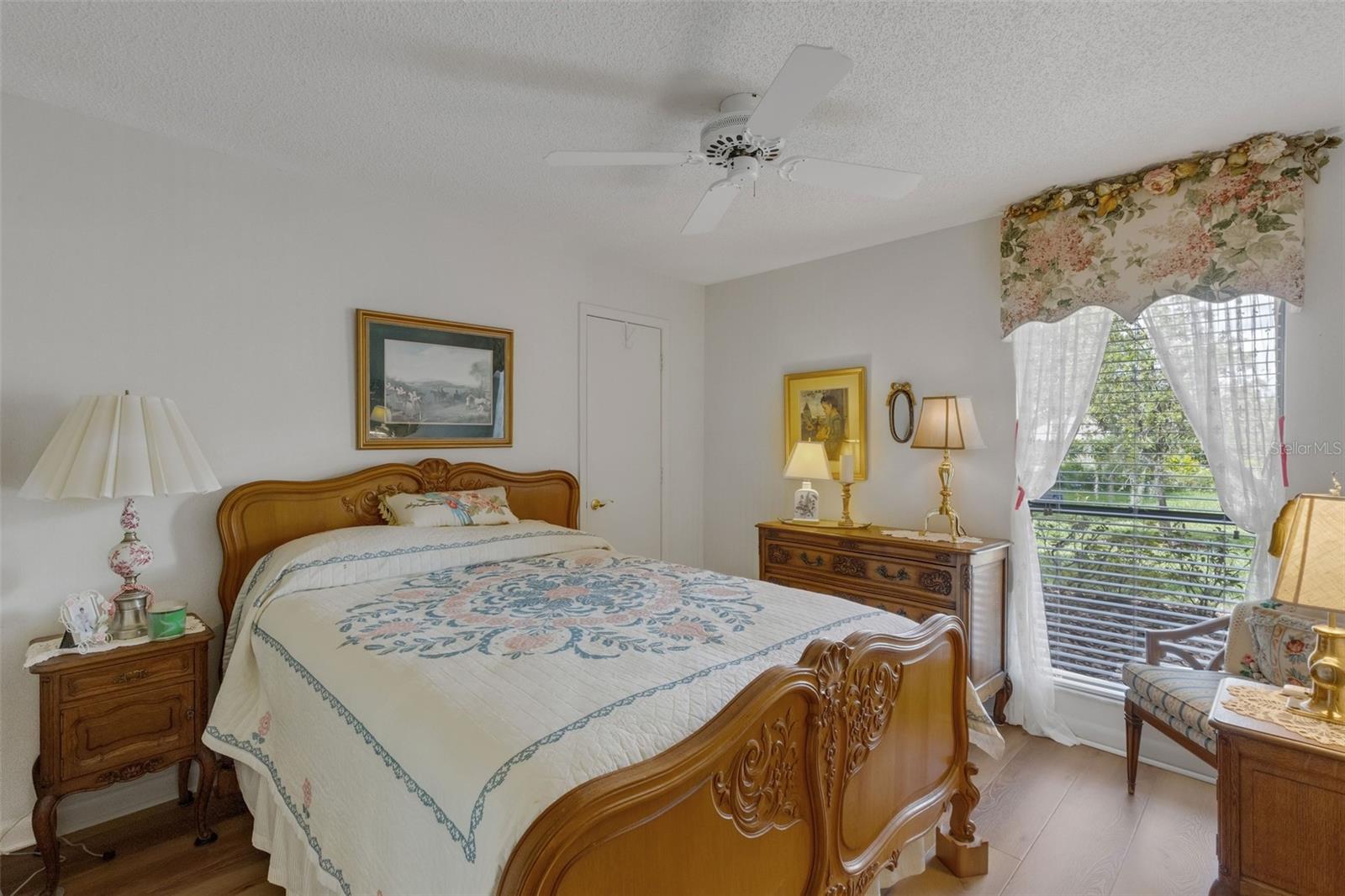 Bedroom #2 has an oversized tall window and walk-in closet.