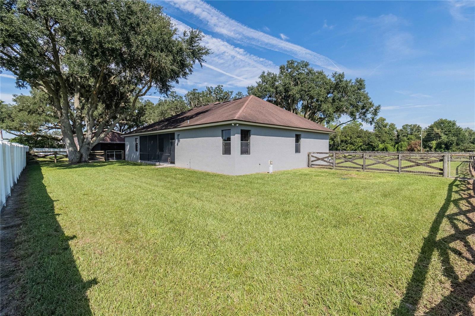 Rear view of home w/separate fencing