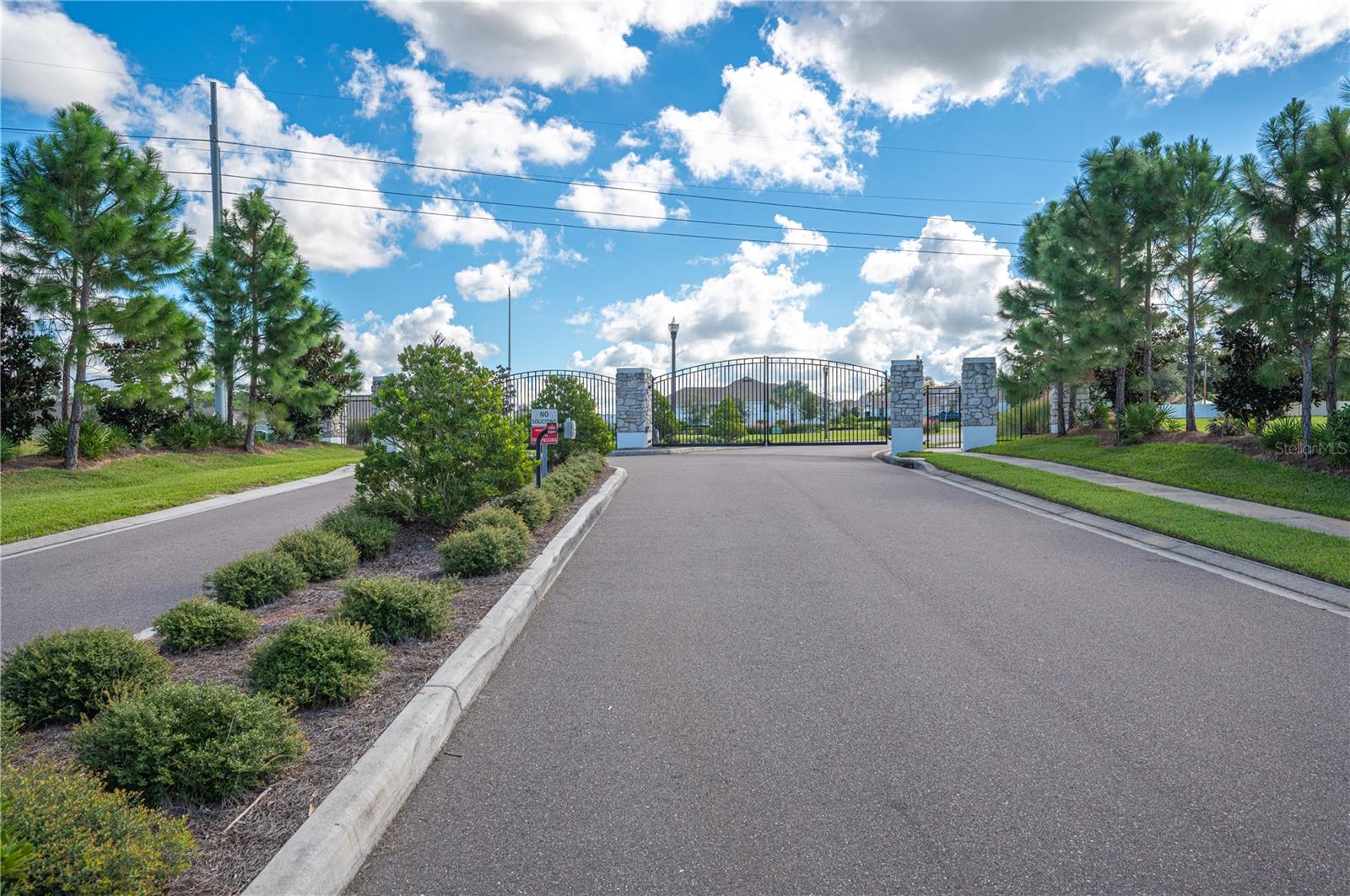 The gated entrance to Woodland Oaks