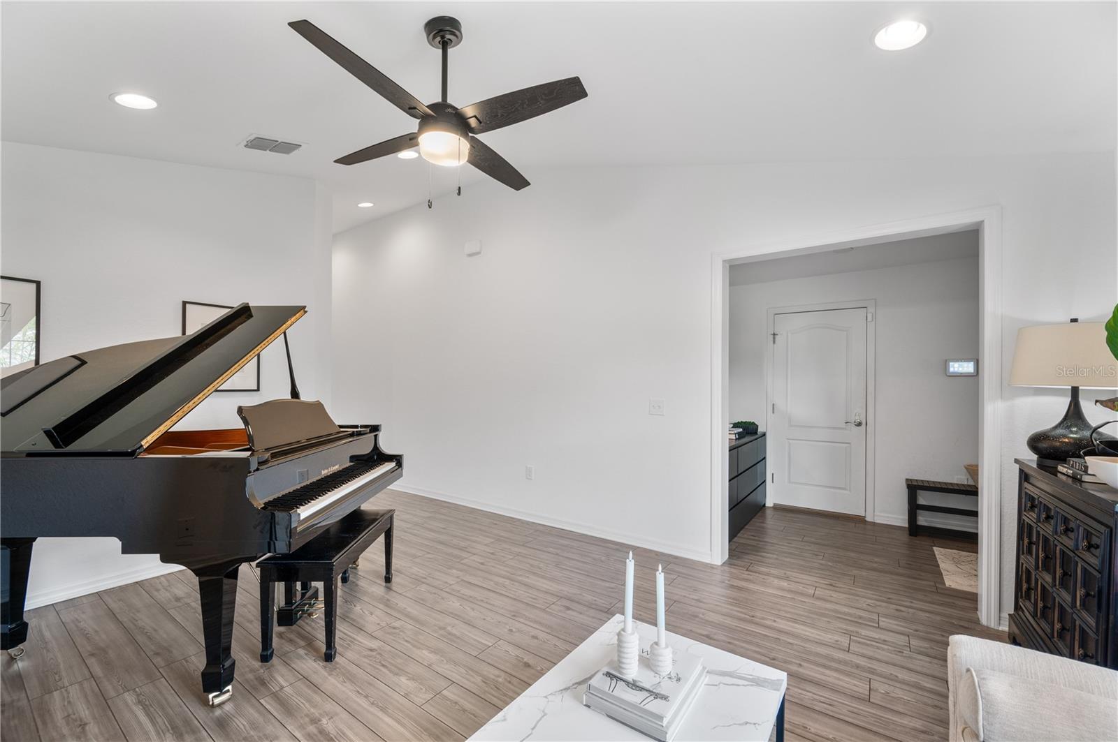The door in the rear of the photo leads to a spacious 2 car garage. The door in the rear of the photo leads to a spacious 2 car garage.