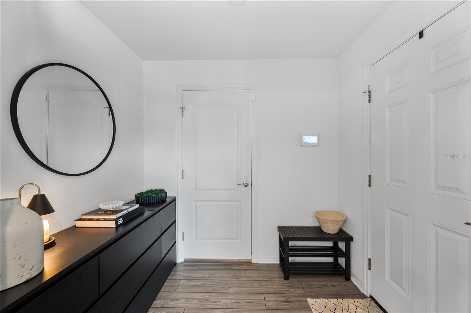 The foyer and entry to the garage