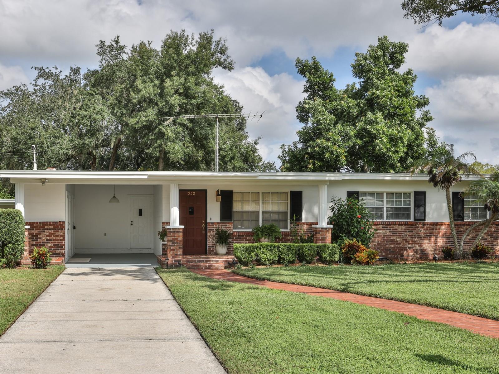 Front of the home with a one car carport.