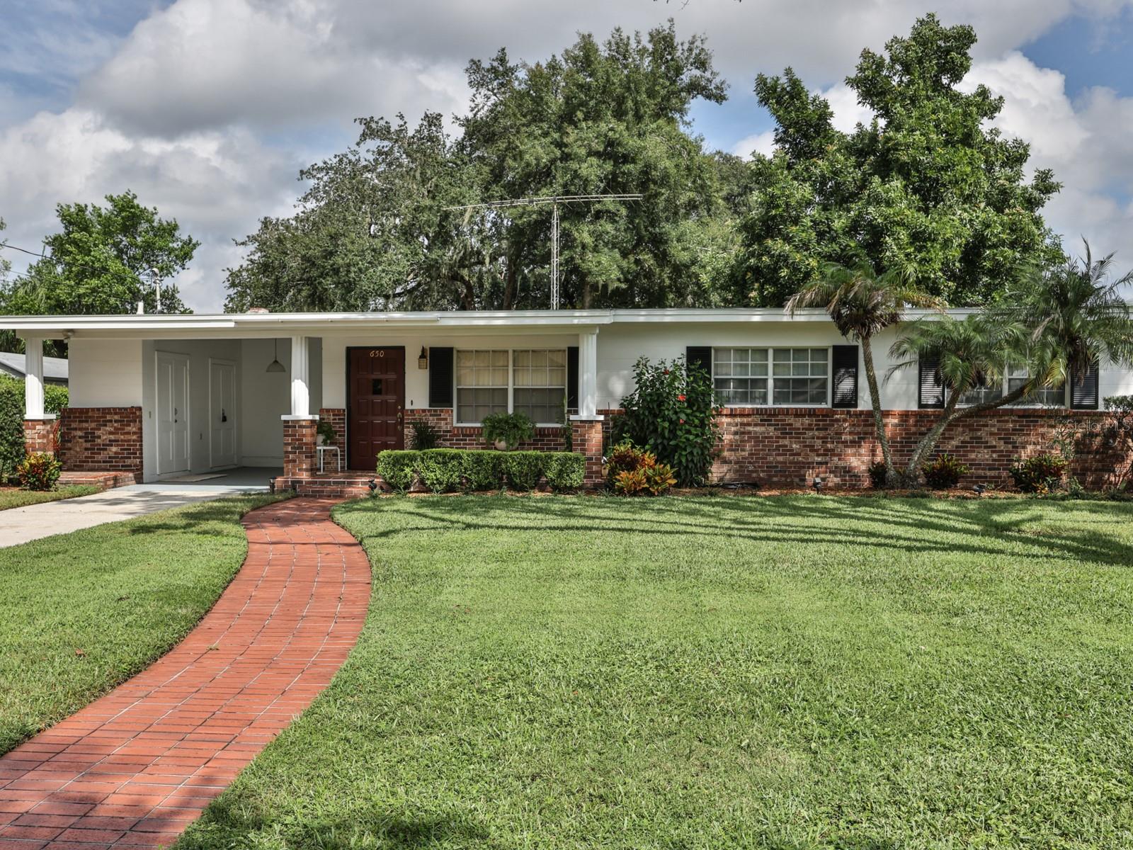 Front of the home with a brick sidewalk. Front of the home with a brick sidewalk.