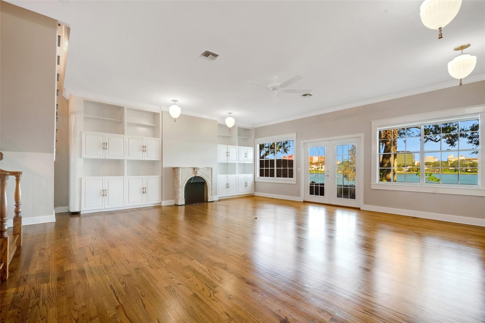 The main living area & dining room combination . There are plenty of built-ins for display & storage ...along with a spectacular view of Lake Morton and downtown Lakeland .