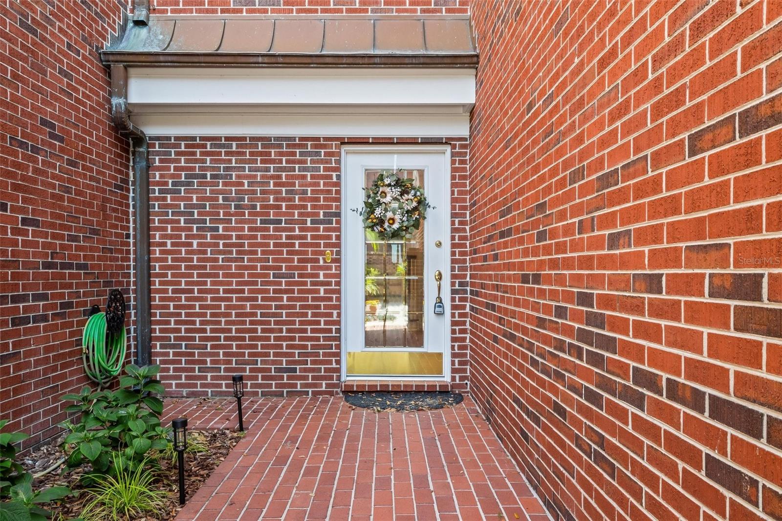 Rear courtyard entry with small real patio Rear courtyard entry with small real patio