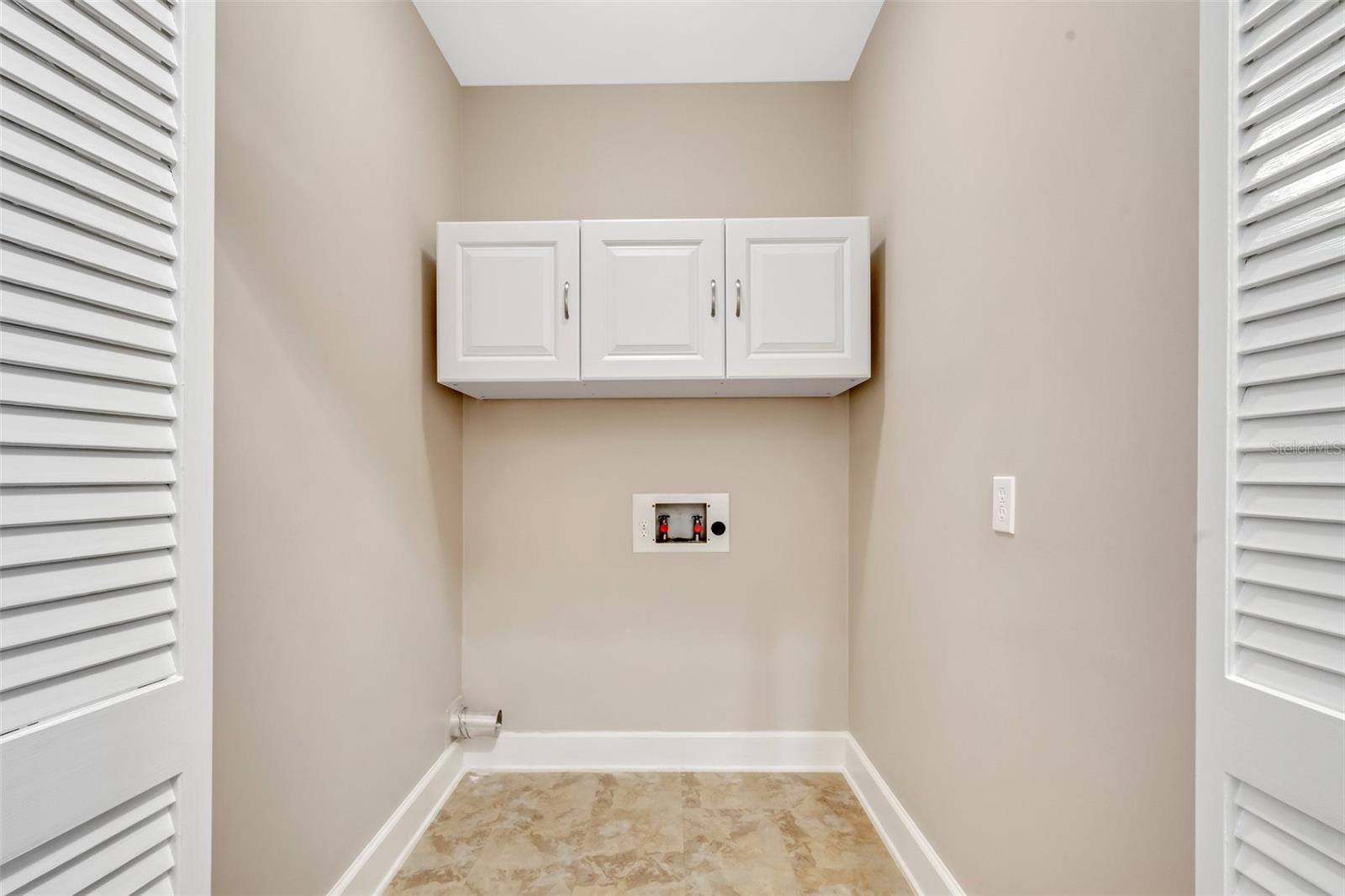 Nice size laundry room with extra storage