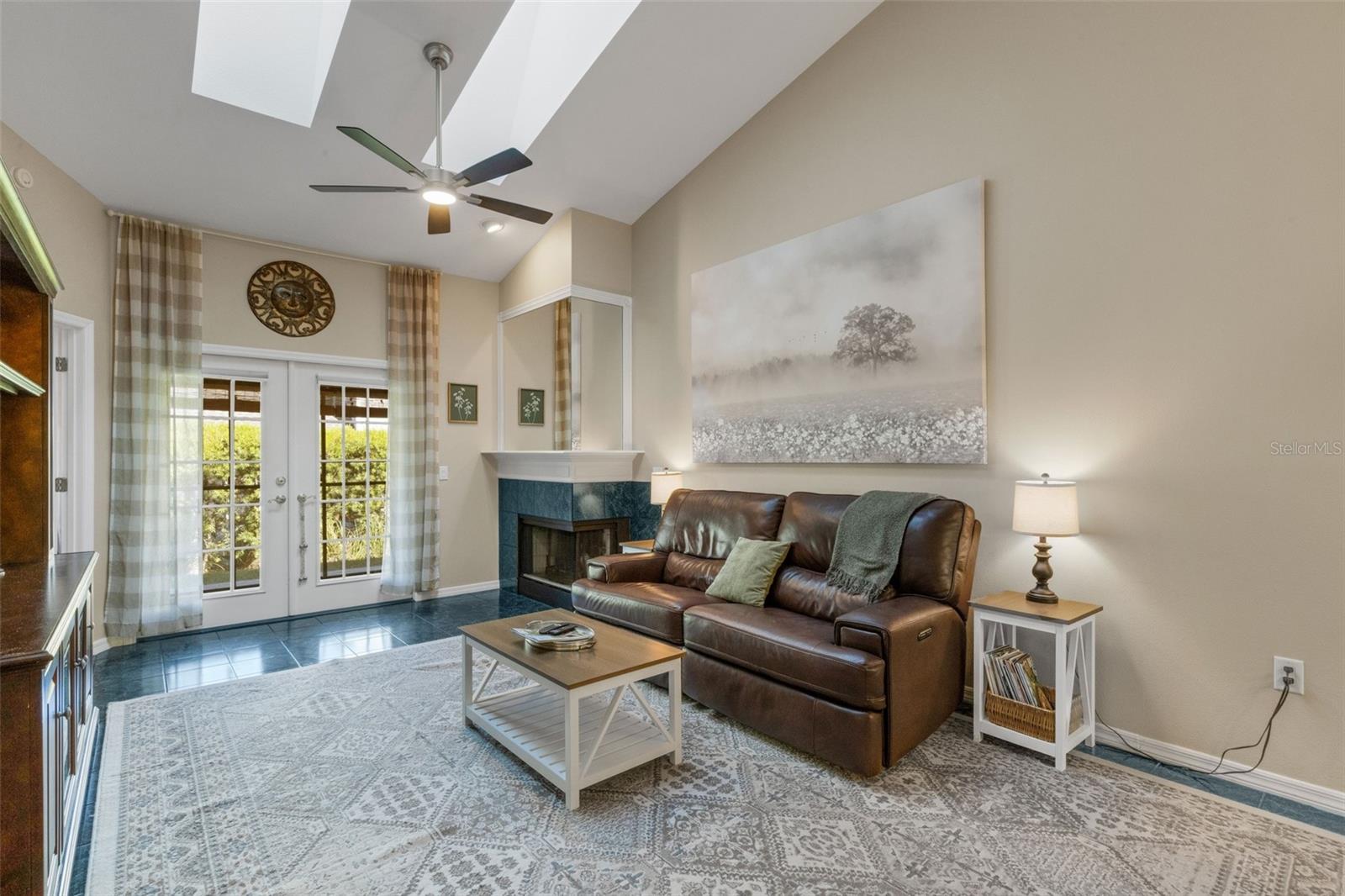 Neutral color palette brightened by two skylights overhead in the vaulted ceiling of the space.