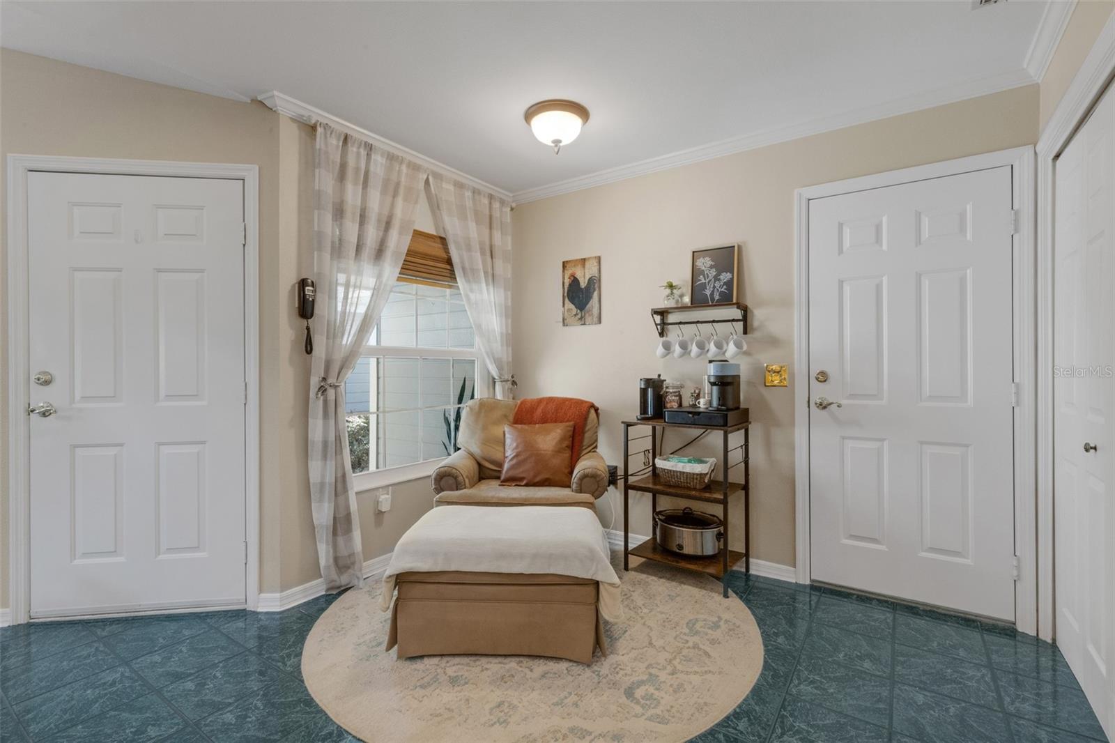 The kitchen dining nook is currently utilized as a "relax with a cup of coffee" spot.