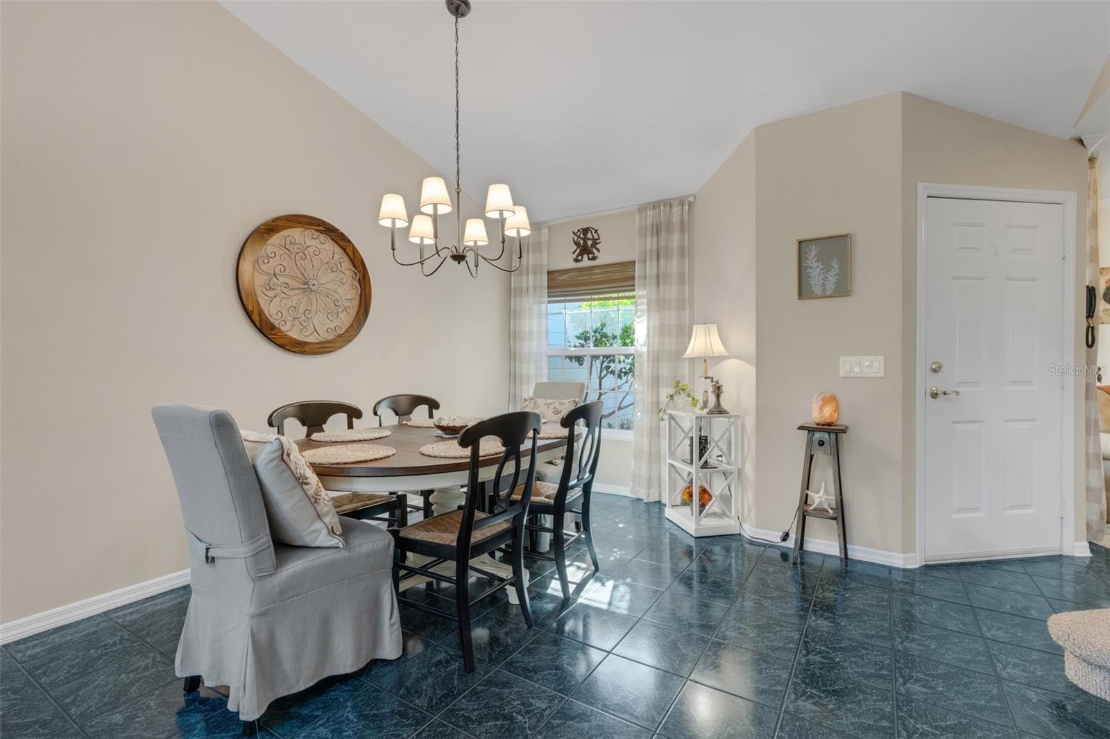 Step inside to the spacious dining & living room combo space decked out in easy care tile flooring. Step inside to the spacious dining & living room combo space decked out in easy care tile flooring.