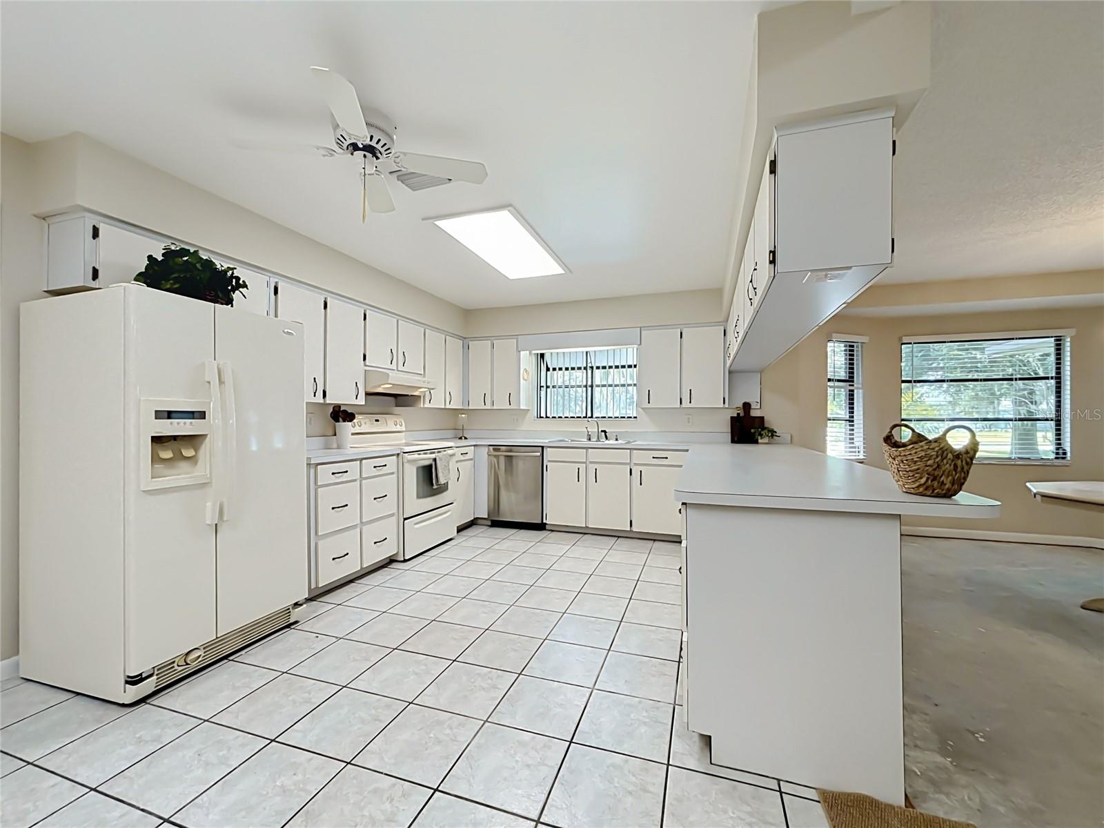 Kitchen features ceramic tile flooring