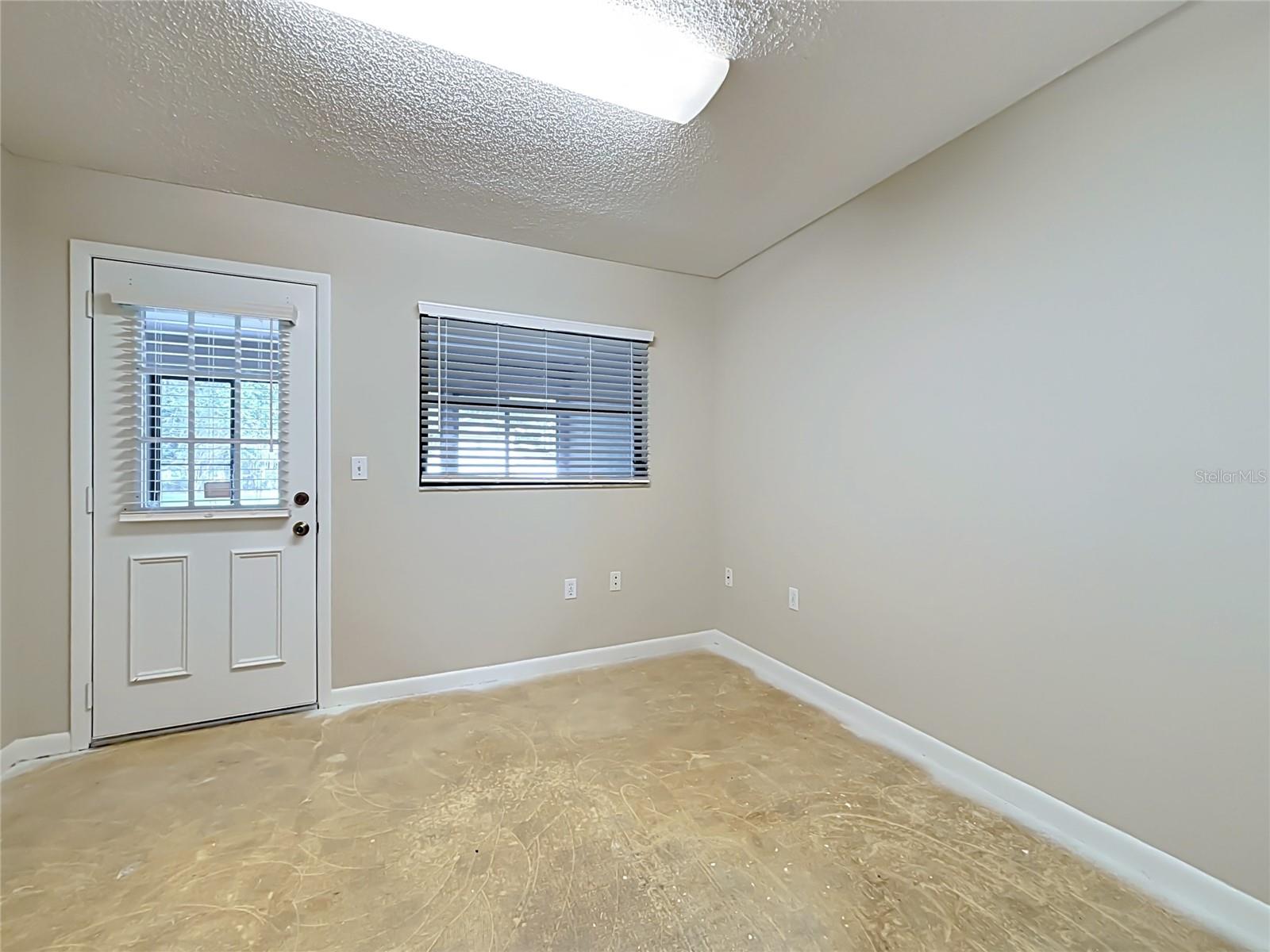 Bonus room/office/playroom has door opening to Florida room