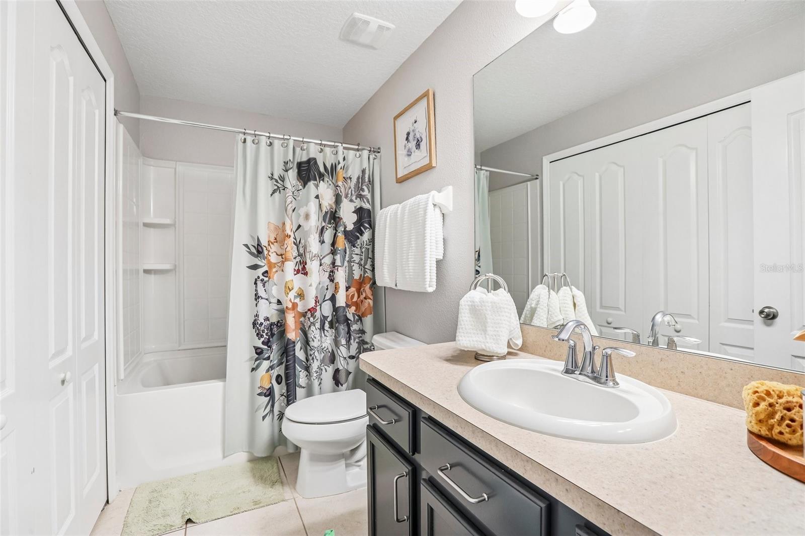 Upstairs Guest bathroom with laundry closet!