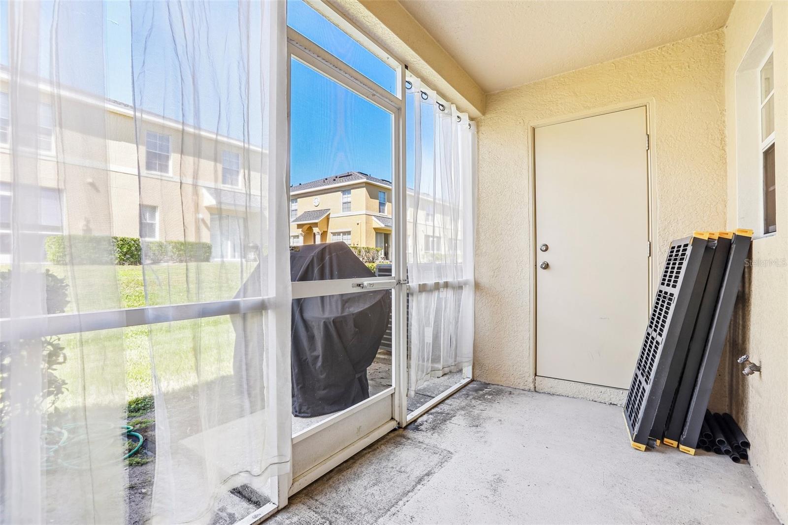 Screened in patio with outdoor storage!
