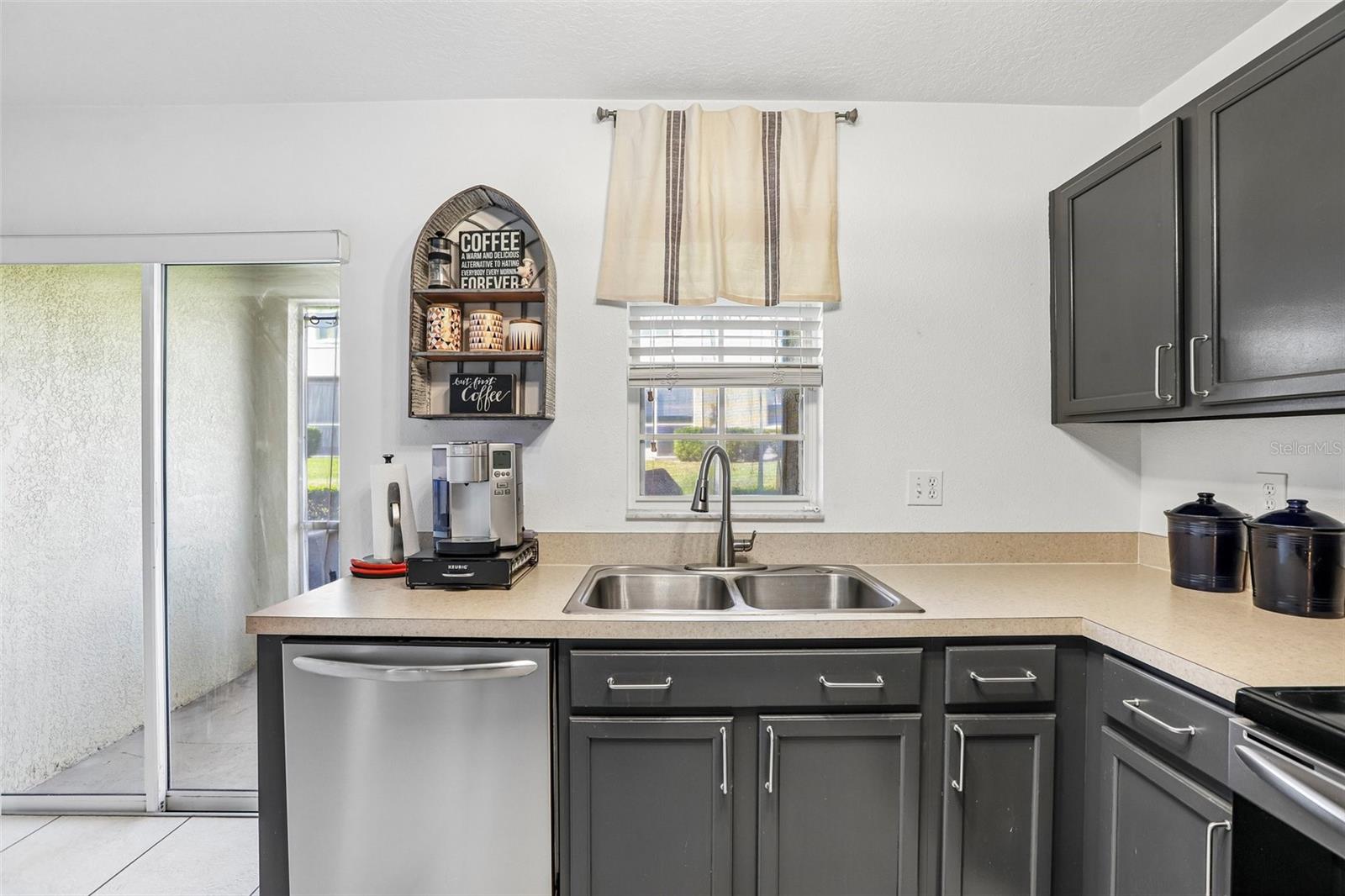 Kitchen located at the rear of the home, allowing natural light to pour in!