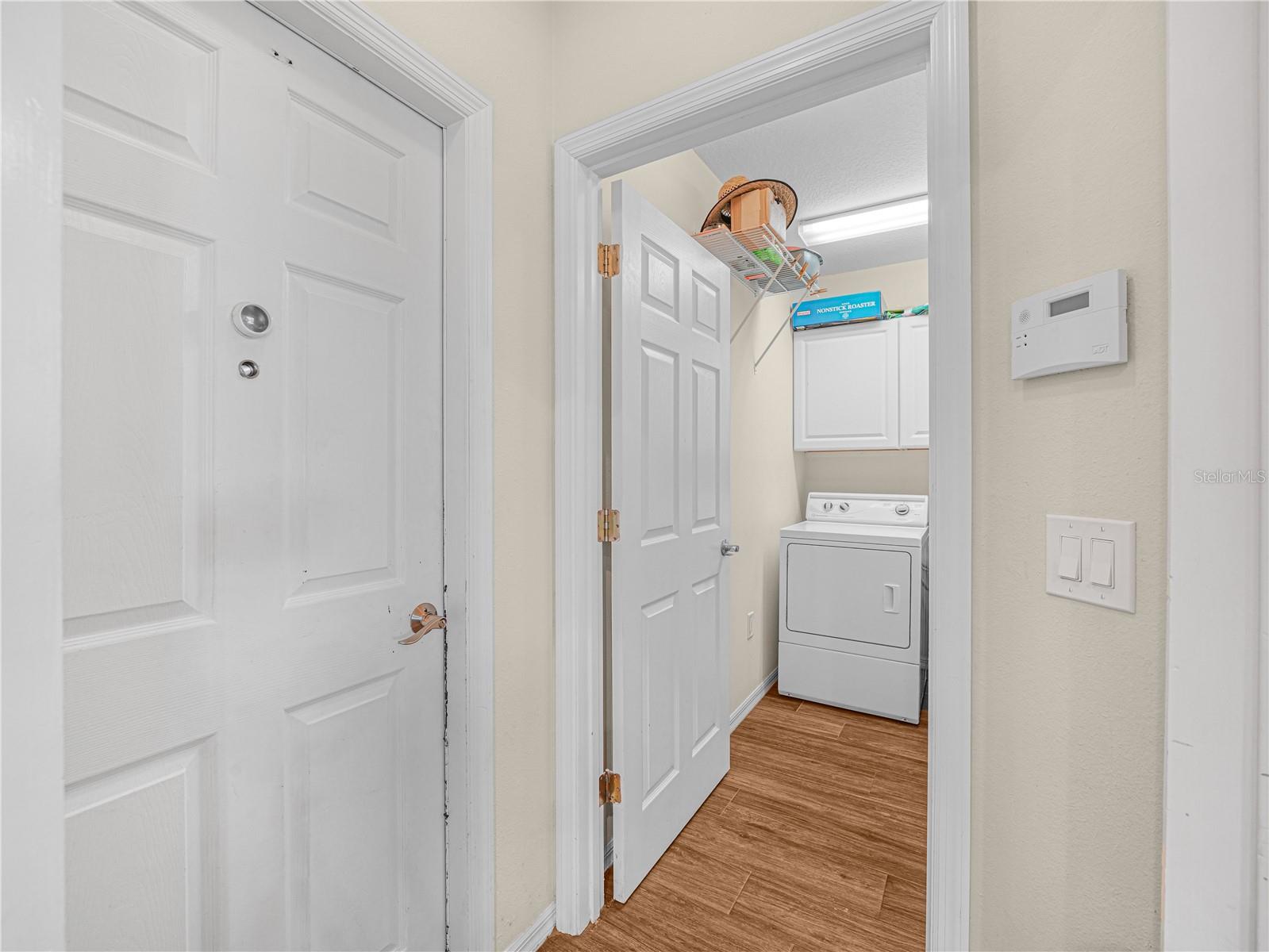 Laundry area with cabinets