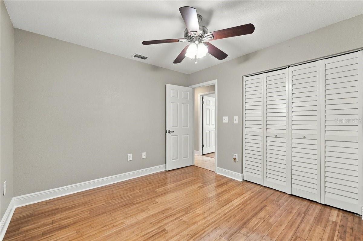 3rd bedroom with ceiling fan, new blinds and bamboo hardwood flooring.