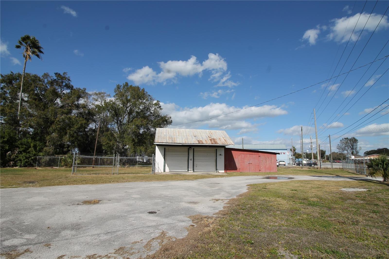 Two Bay garage with over sized Doors, the red portion will be retained by the owner for their personal supplies. Two Bay garage with over sized Doors, the red portion will be retained by the owner for their personal supplies.