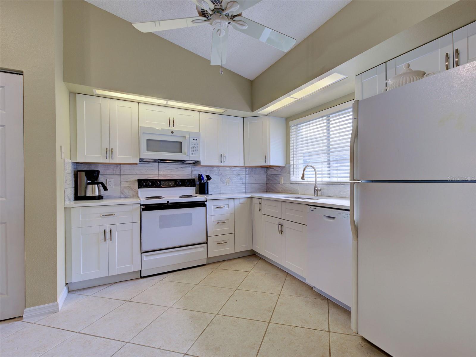 kitchen.... new dishwasher, microwave, soft close cabinets, backsplash