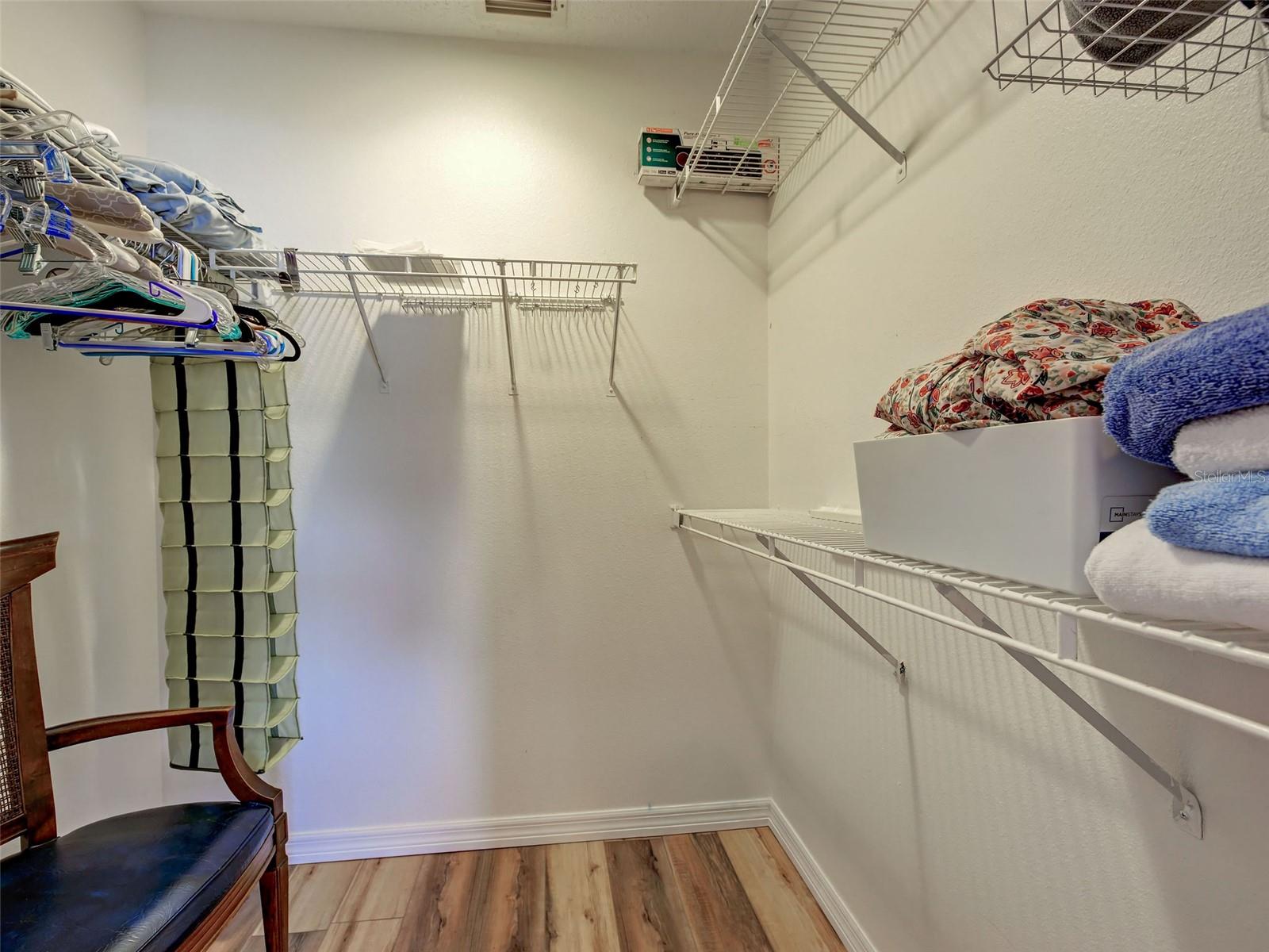 primary bedroom walk in closet, primary bedroom also has an ensuite bathroom