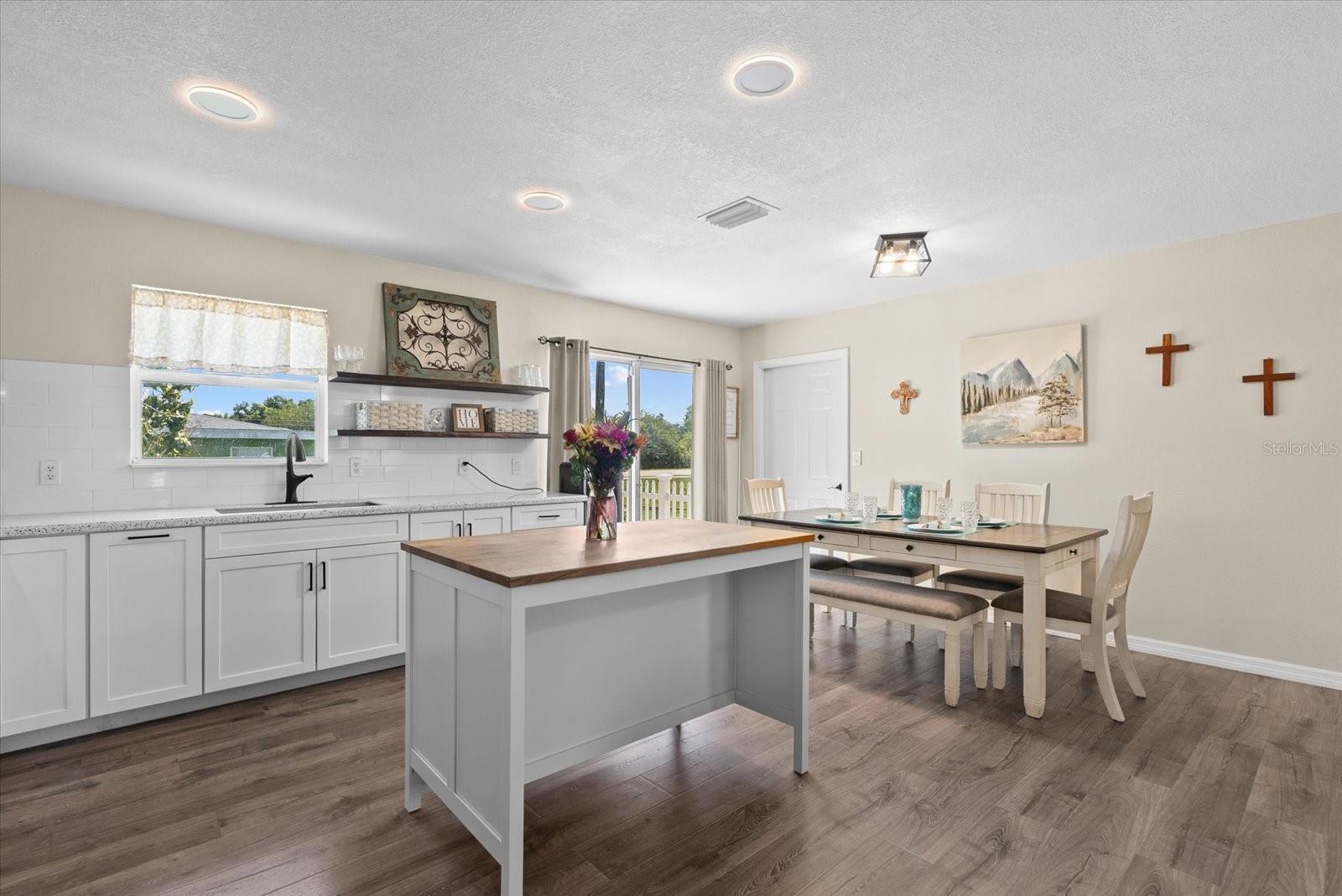 Kitchen open to dining and living room