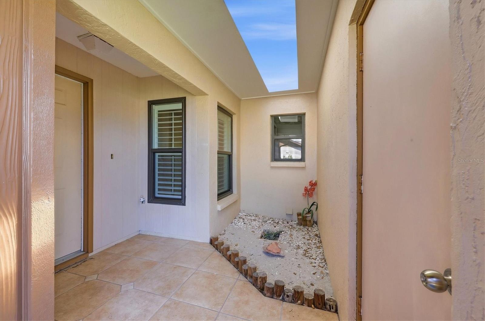 Entrance between garage door and front door